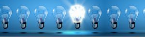 Image of lightbulbs in a row with blue background
